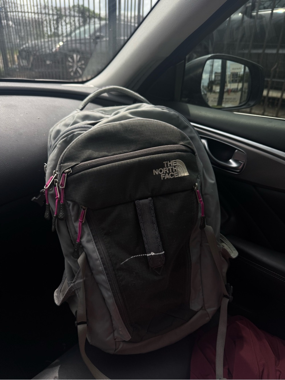 The North Face Gray Backpack with Black Interior and Yellow Logo